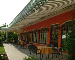 Awning eurosol 3020 striped with green and white flap on terrace