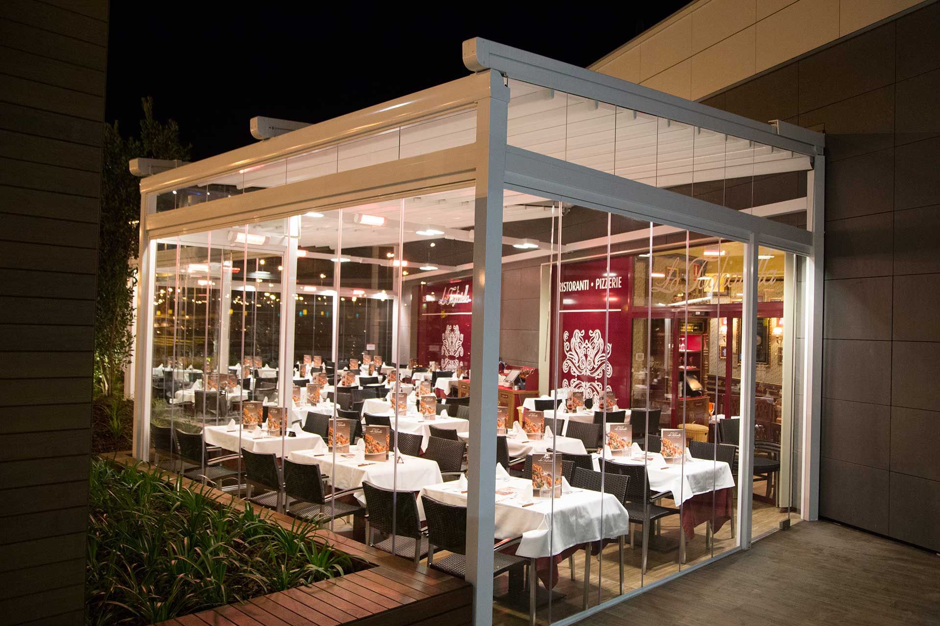 Smooth pergola with enclosures, heating and lighting