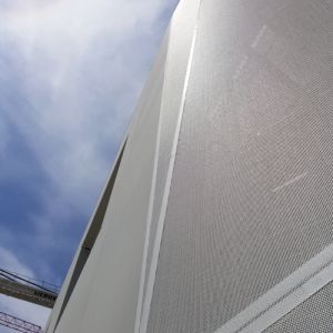 Tensioned membrane with holes