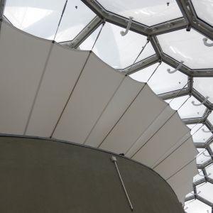 Stretched PVC canvas under the ETFE cushions.