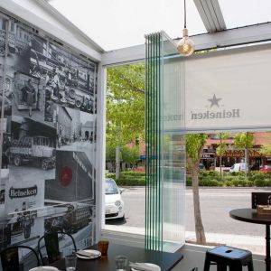 Retractable glass curtains in a tapas bar in Madrid
